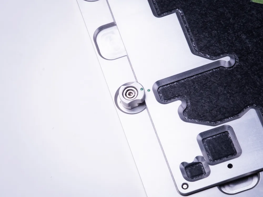 Detail of a conformal coating carrier, showing the masked keep-out zone