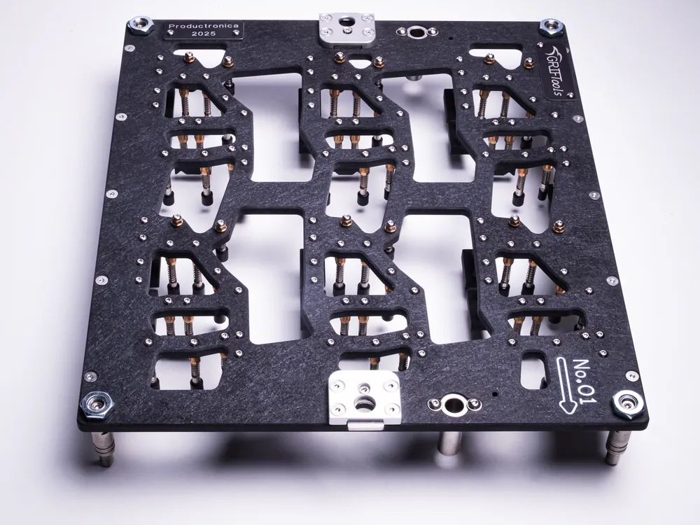 Wave solder carrier seen from above, with milled openings for the through-hole joints