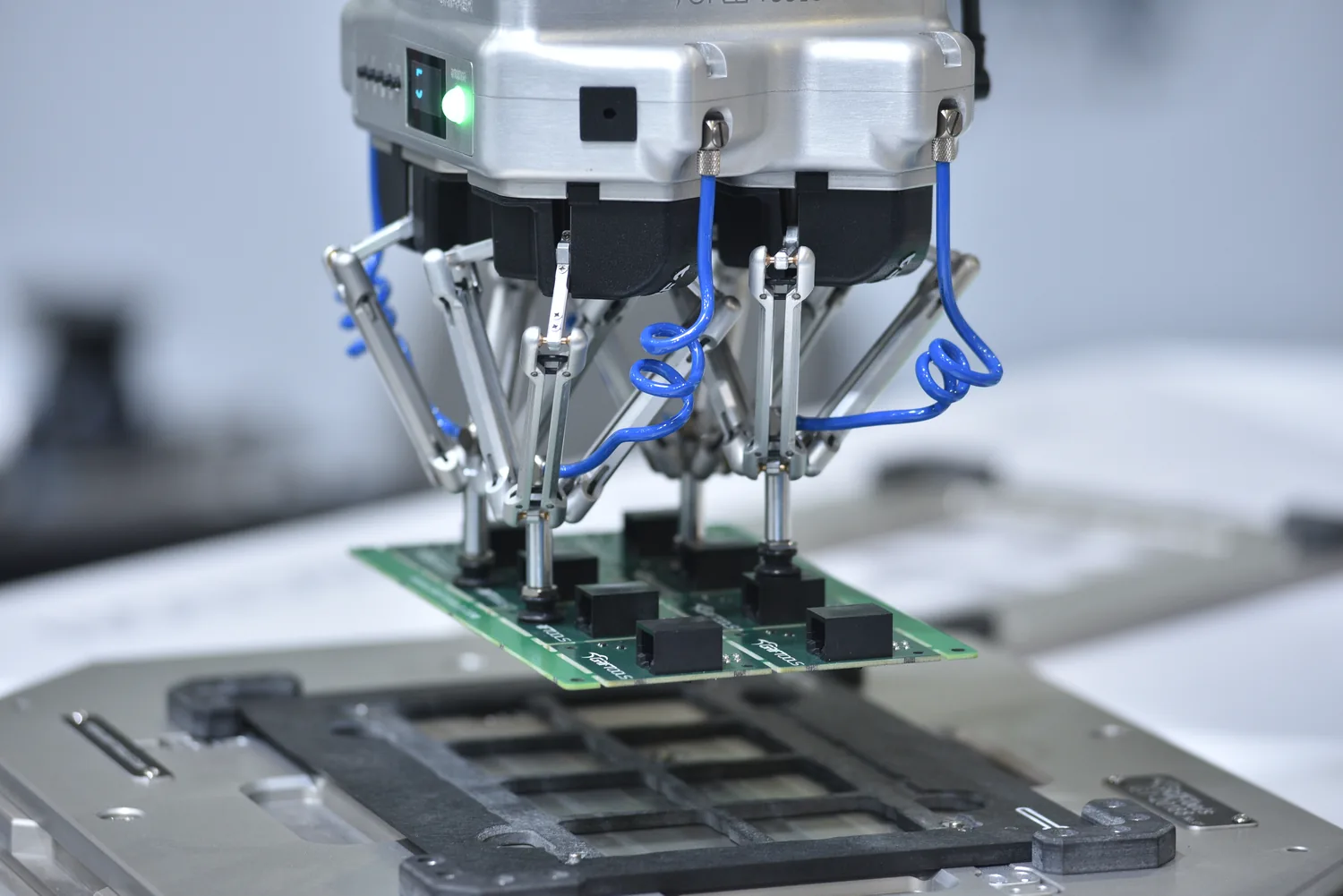 MPG Multi Parallel Gripper picking components from a populated PCB