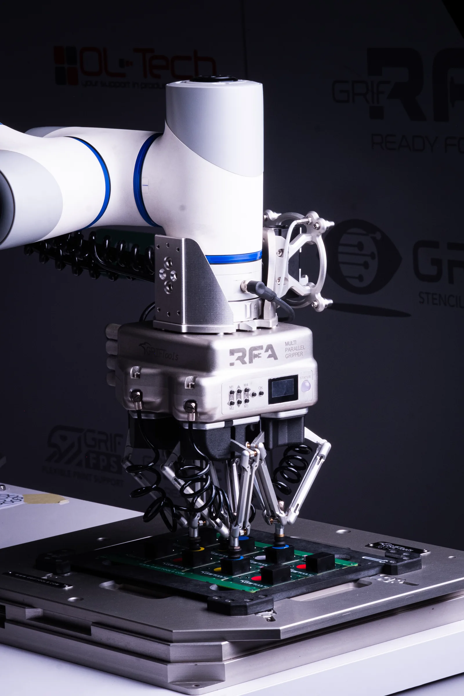 MPG Multi Parallel Gripper mounted on a robot arm above a PCB nest